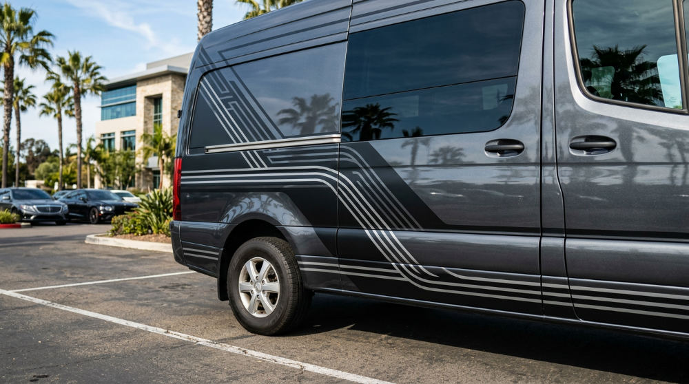 Physical vinyl straight line graphics applied to the side of a professional corporate vehicle.